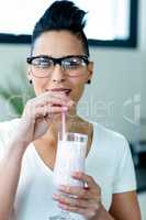 Close-up of woman drinking smoothie