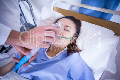 Doctor examining a patient on bed
