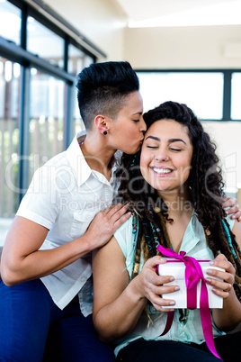 Woman receiving a gift from her partner