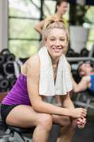 Smiling woman working out with dumbbells