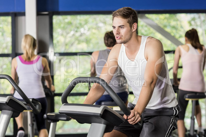 Fit man doing exercise bike