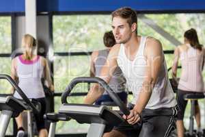 Fit man doing exercise bike