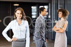 Confident businesswoman looking at camera in office