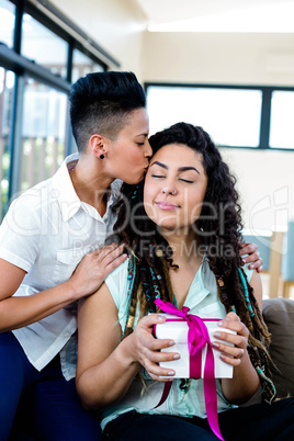 Woman receiving a gift from her partner