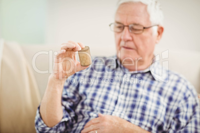 Senior man holding a pill bottle