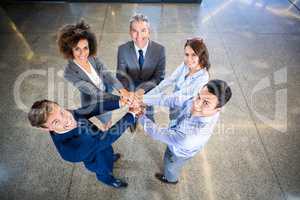 Businesspeople hands stacked over each other