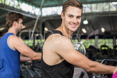 Fit man on elliptical bike