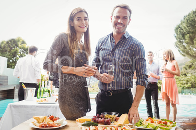 Happy young friends having drinks