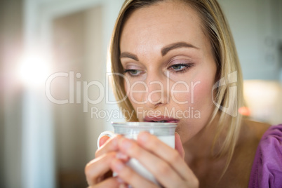 Pretty blonde woman having coffee