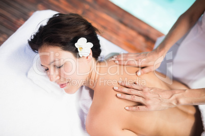 Woman receiving a back massage from masseur