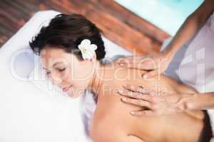 Woman receiving a back massage from masseur