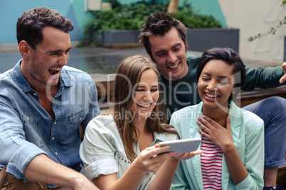 Happy friends using smartphone