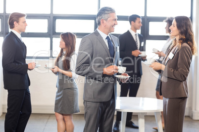 Businesspeople having a discussion during breaktime