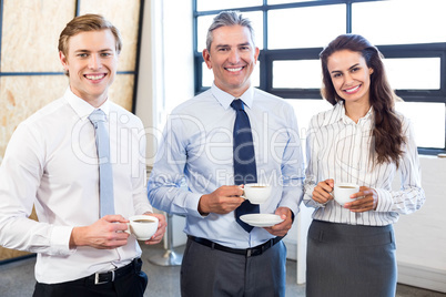 Businesspeople standing together in office