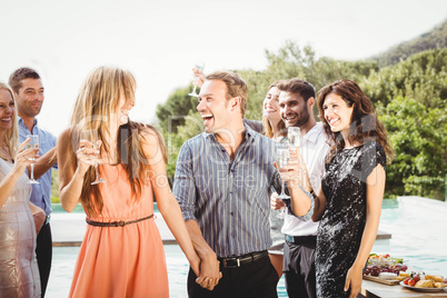 Happy young friends having drinks