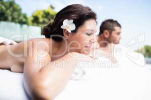 Young couple relaxing on massage table