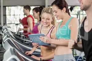 Athletic women looking at tablet