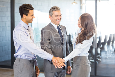 Businesspeople hands stacked over each other