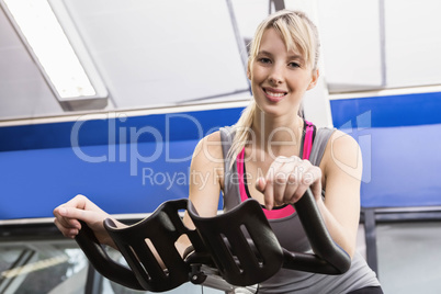 Fit woman on exercise bike