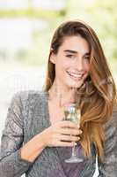 Portrait of beautiful woman having champagne flute