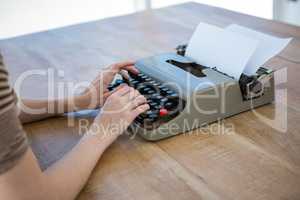 female hands typing on a typewriter