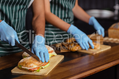 Close up of baristas preparing sandwiches