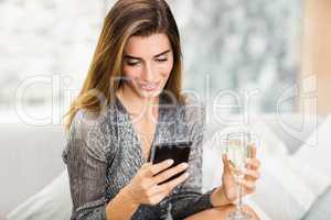 Beautiful woman text messaging on mobile phone