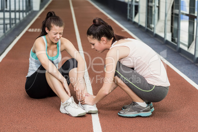 Fit woman having an ankle pain