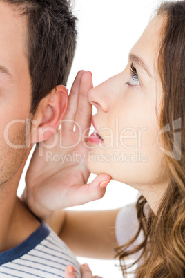 Young couple sharing a secret