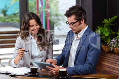 People using tablet and notebook