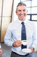 Business executive having a cup of tea