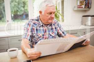 Senior man reading a newspaper