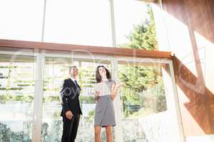 Real-estate agent showing young woman new home