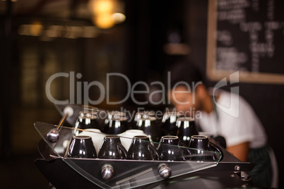 Cups on coffee machine