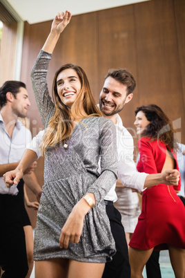 Group of young friends dancing