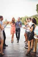 Happy young friends having drinks