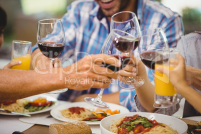 Family toasting glasses of wine