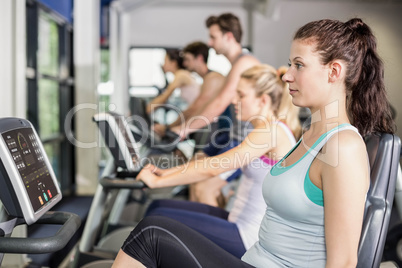 Fit people doing exercise bike