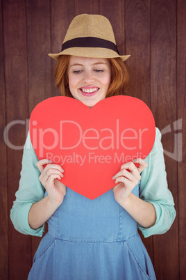 Pretty hipster holding heart Pretty hipster holding heart