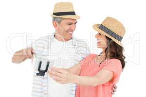 Happy couple using a selfie stick