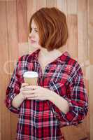 beautiful hipster woman holding a coffee cup
