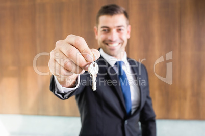 Real-estate agent giving keys