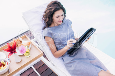 Young woman writing in a planner