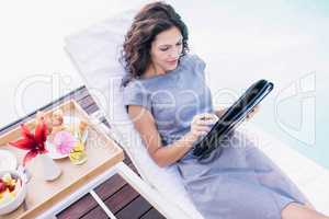 Young woman writing in a planner