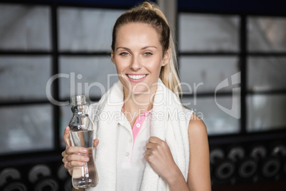 Smiling woman drinking water