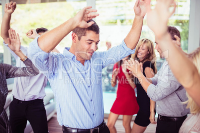 Group of young friends dancing