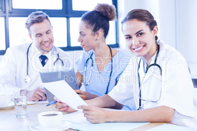 Female doctor meeting with colleagues