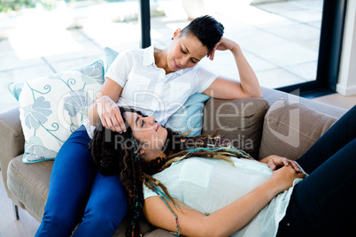 Woman relaxing on her partners lap