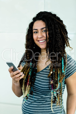 Portrait of woman typing a text message