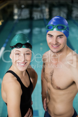 Couple in swimsuits looking at the camera